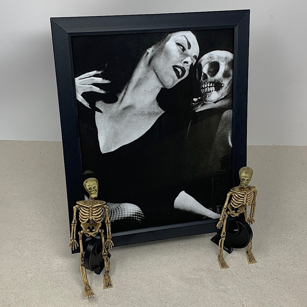 Vampira with skull head 8x10” picture frame on Display Easel with 2 skeletons